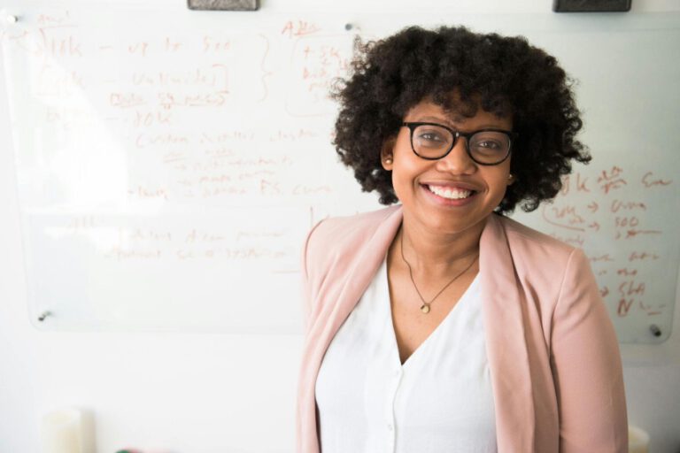 Woman with glasses smiling