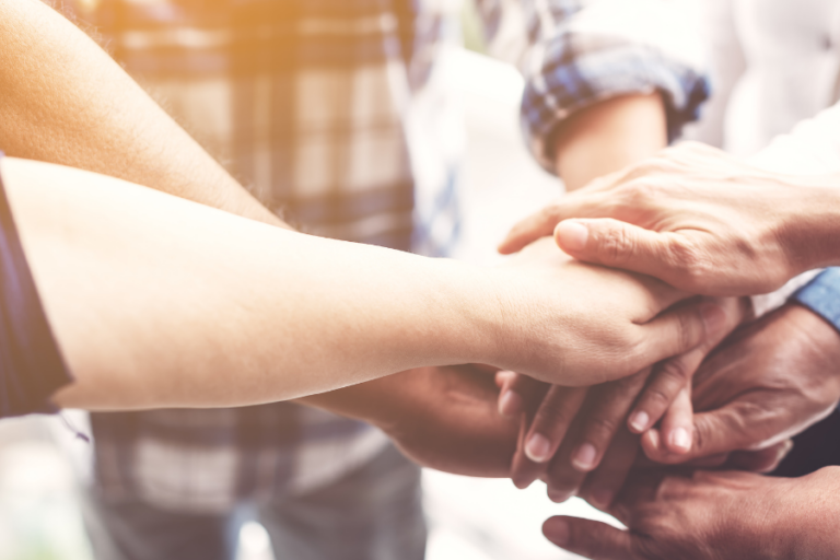 People with hands together